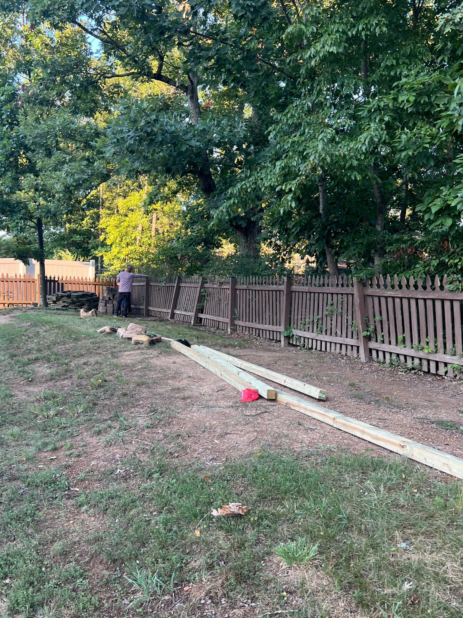 Backyard fence repair work in progress