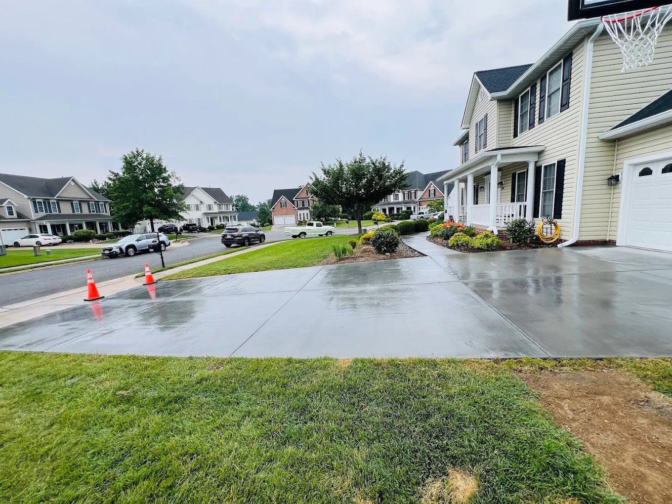 Cleaned concrete driveway after exterior cleaning