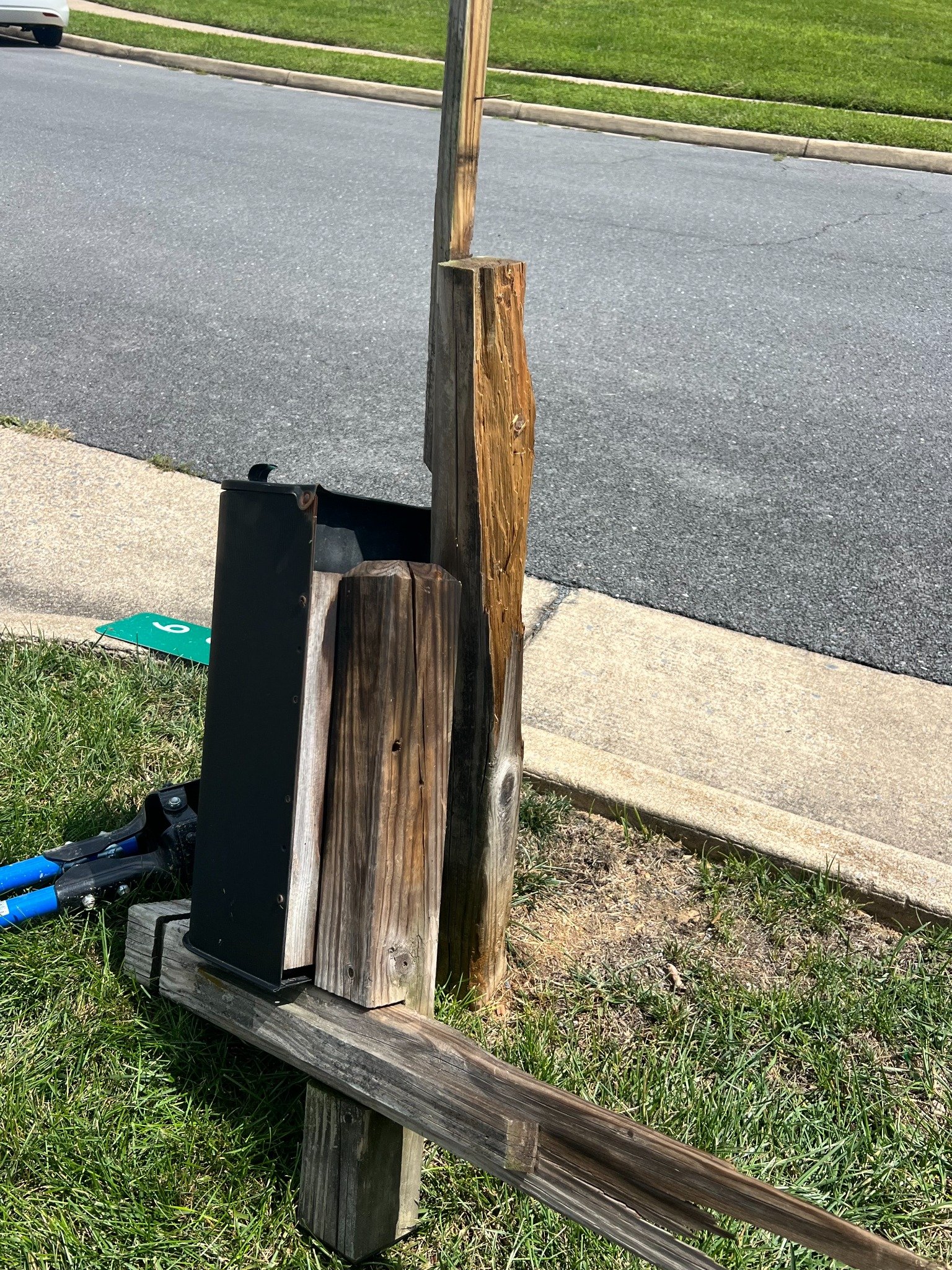 Damaged mailbox post before replacement
